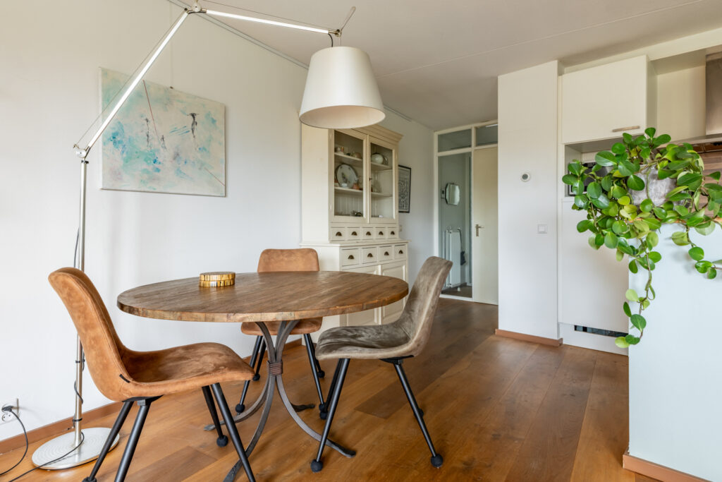 Stylish dining room with wooden table and chairs