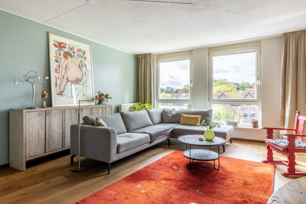 Modern living room with gray sofa and colorful decor
