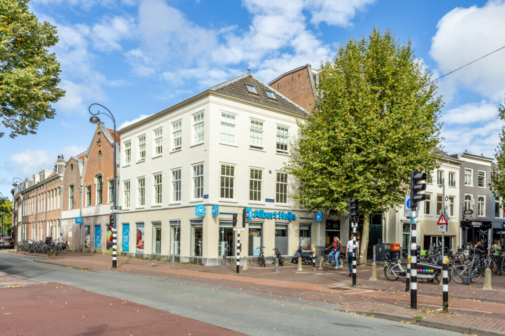 Street view with white building and shops