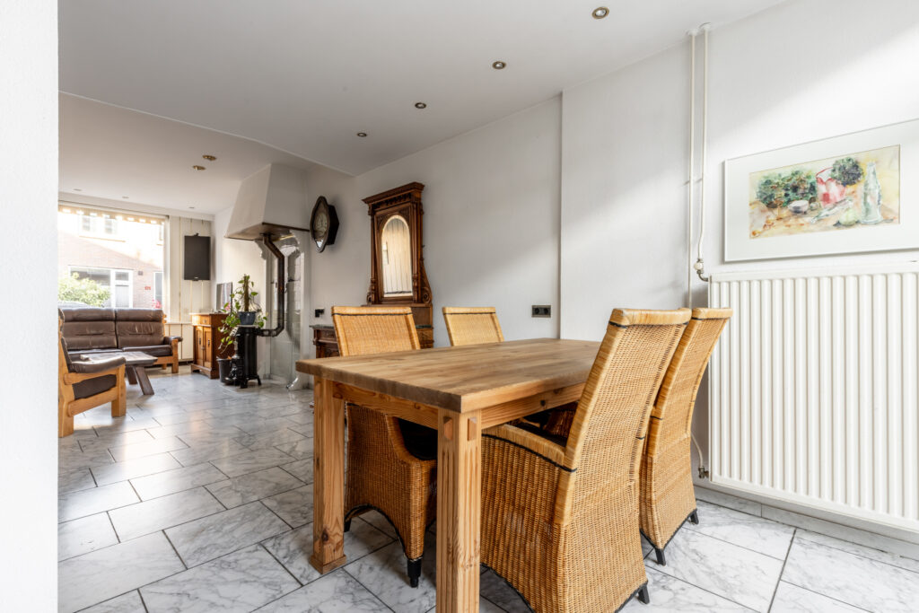 Modern dining and living room with natural light.