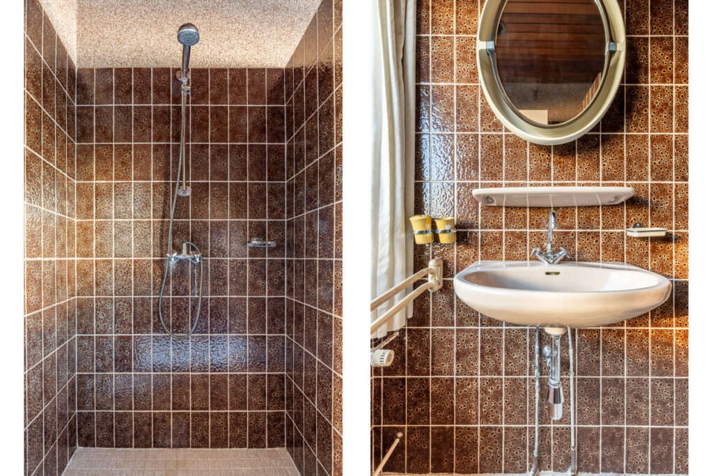Retro brown-tiled bathroom with shower and sink