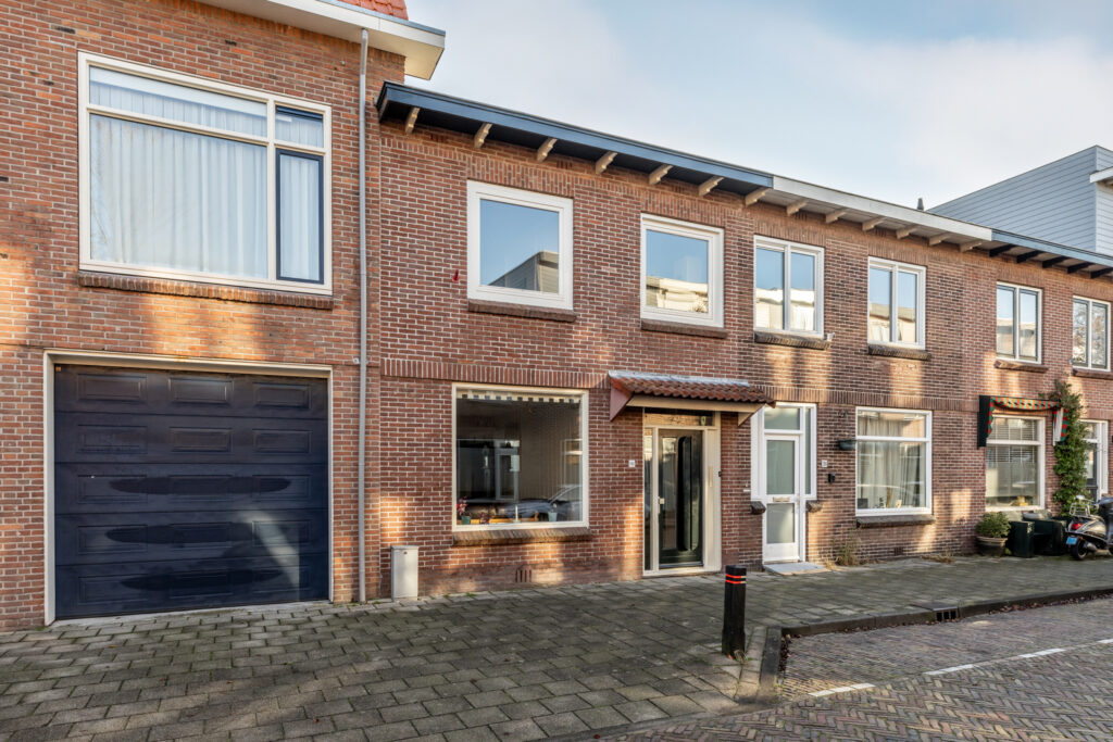 Brick residential houses with front garage doors
