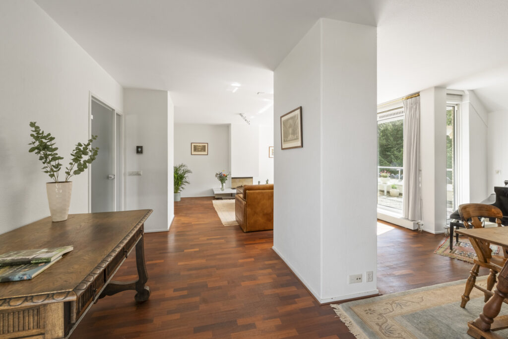 Bright, elegant living room with wooden floors.