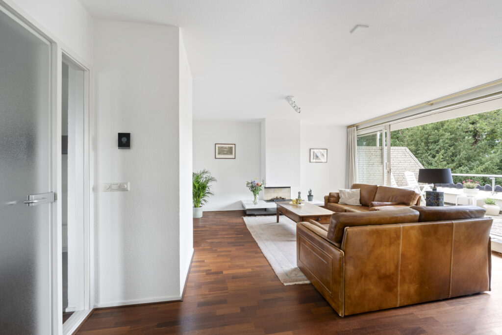 Modern living room with brown leather sofas.