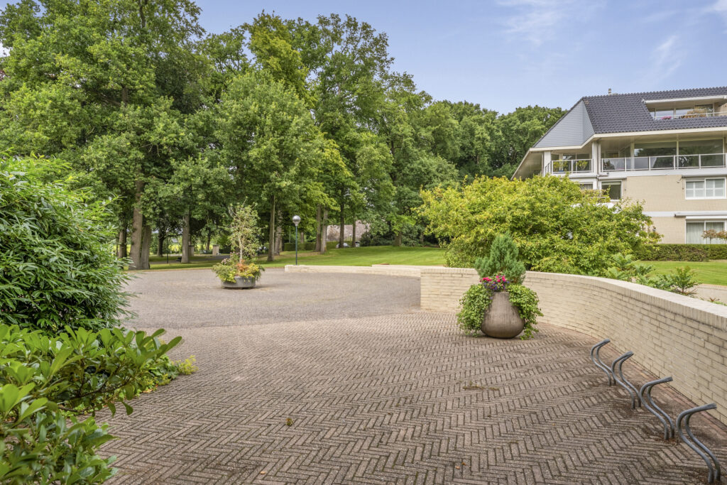 Scenic view of garden with apartment building