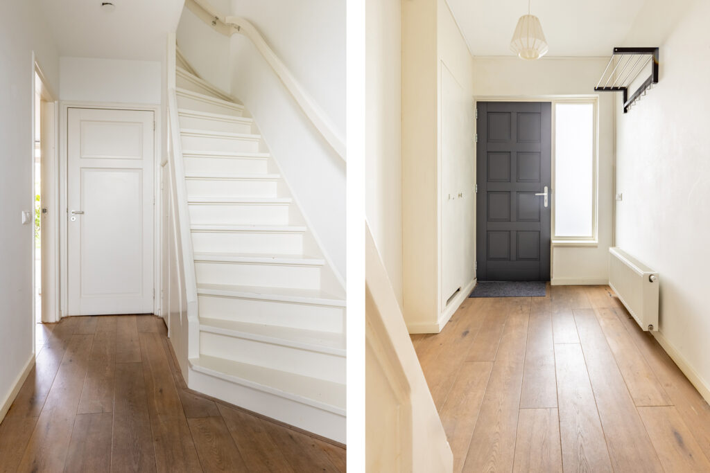 Modern home entrance and staircase with wood flooring.