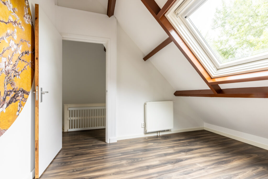 Modern attic room with bright skylight