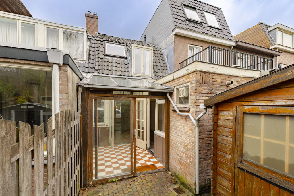House with patio and glass doors.
