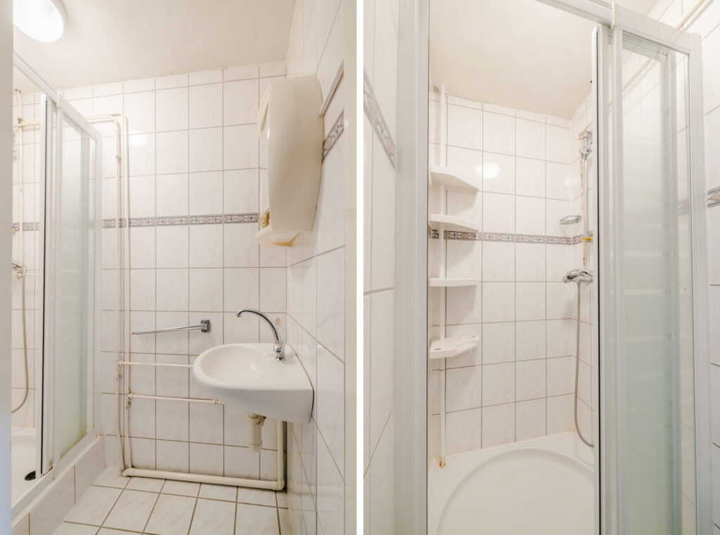 Small tiled bathroom with shower and sink