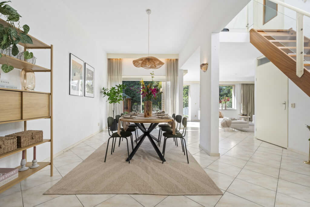 Modern dining room with table and chairs.