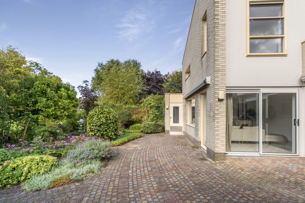 Modern house with a lush garden path
