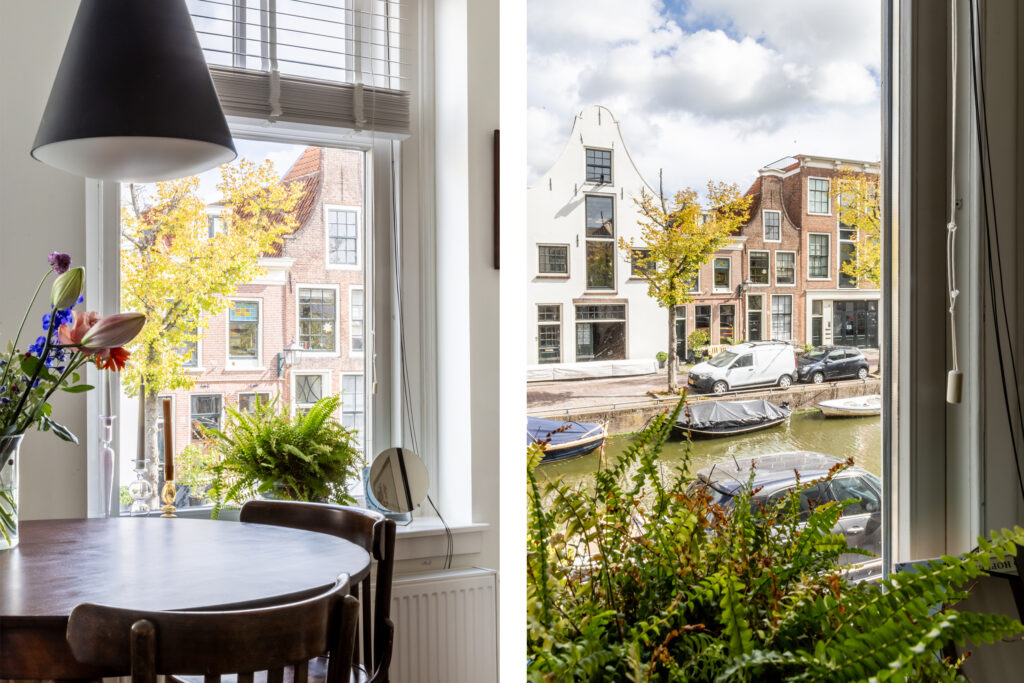 Cozy apartment view of canal and historic buildings.