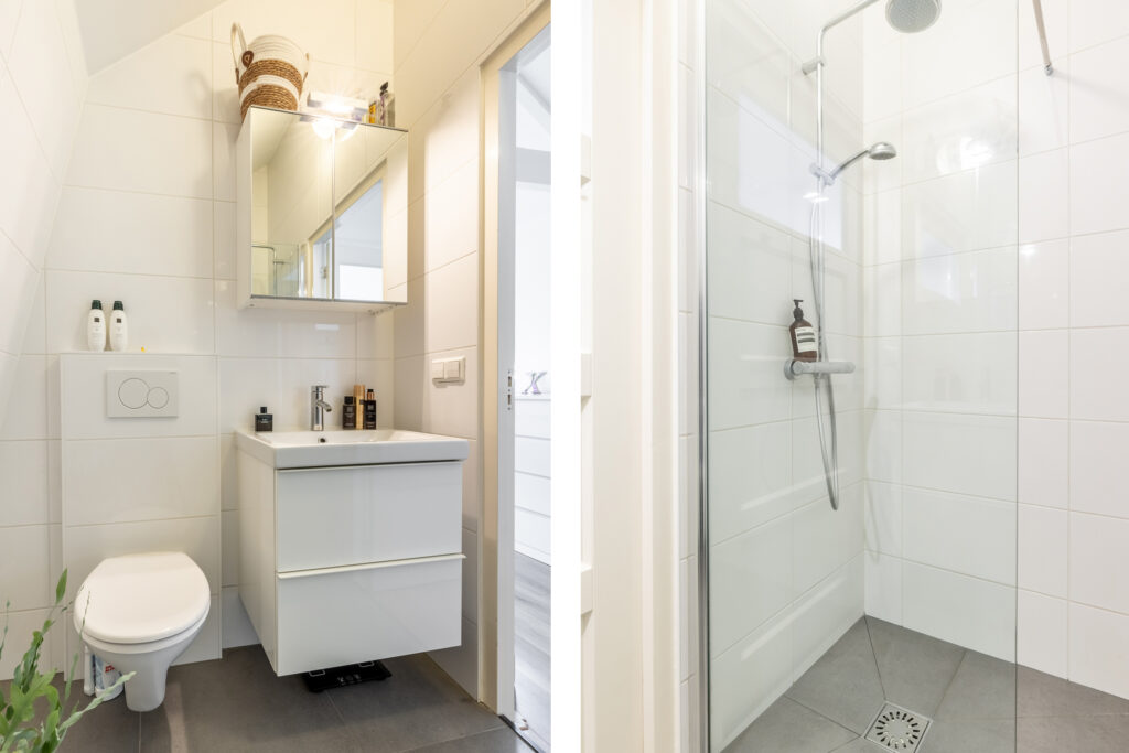 Modern bathroom with shower and vanity.