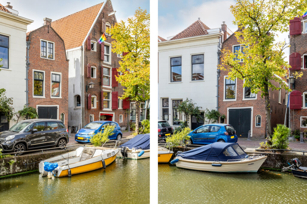 Colorful houses and boats along a canal.