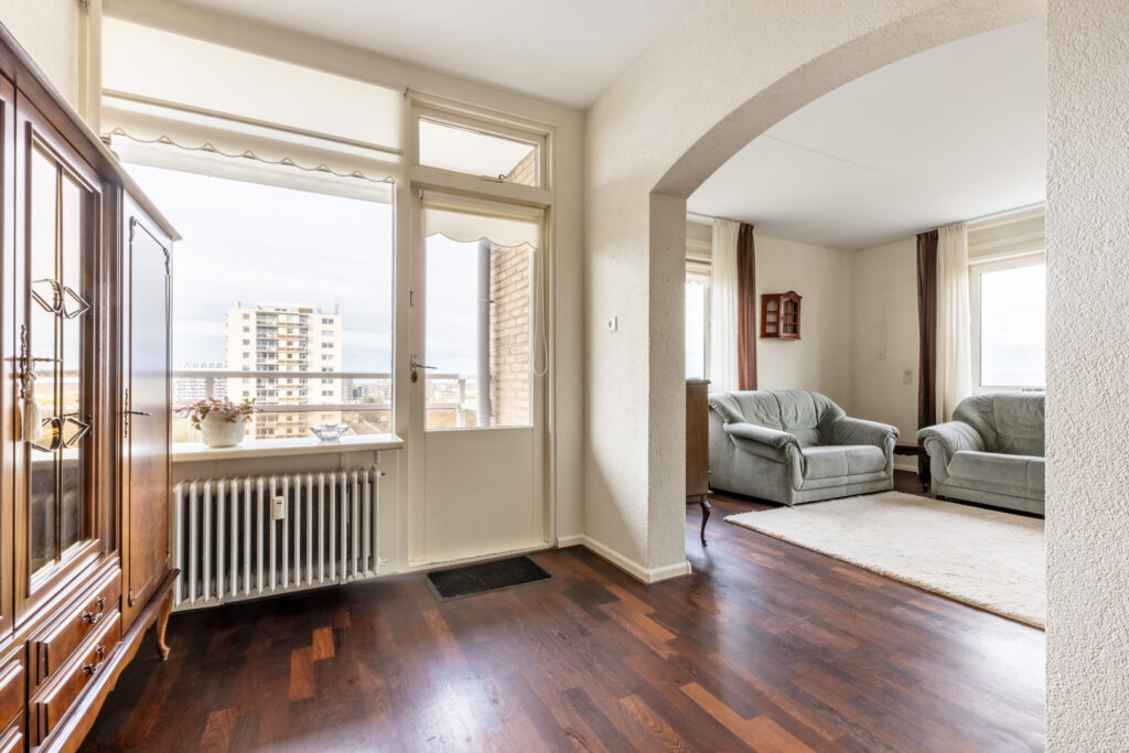 Bright room with wooden floors and furniture.