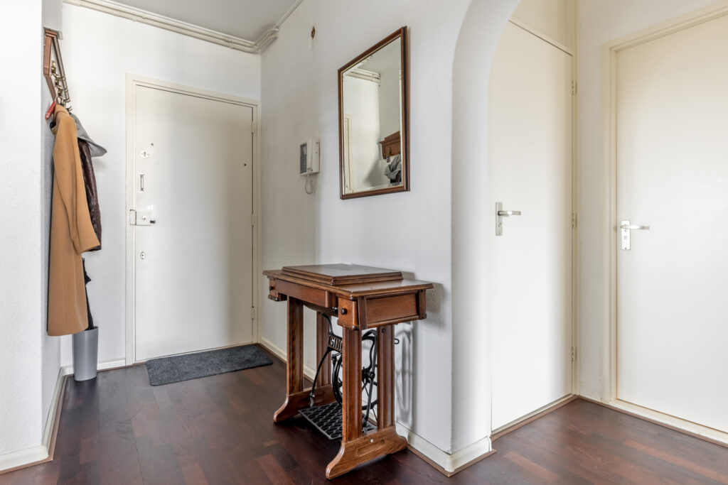 Cozy hallway with mirror and coat rack