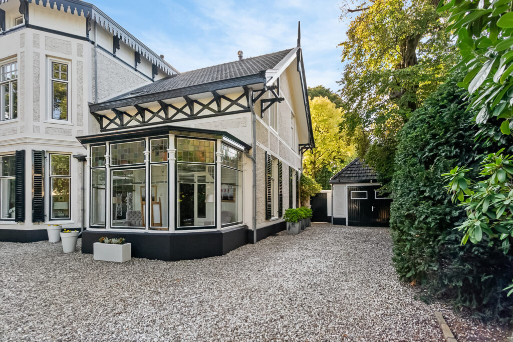 Charming historic house with garden and shed.