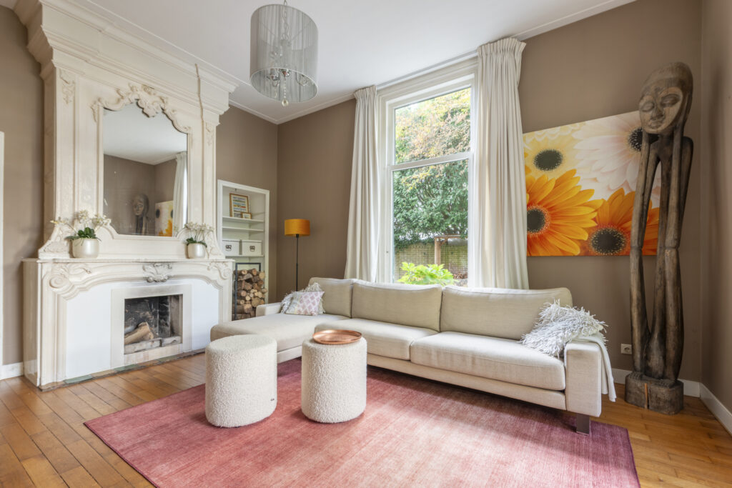 Cozy living room with large window and art decor.
