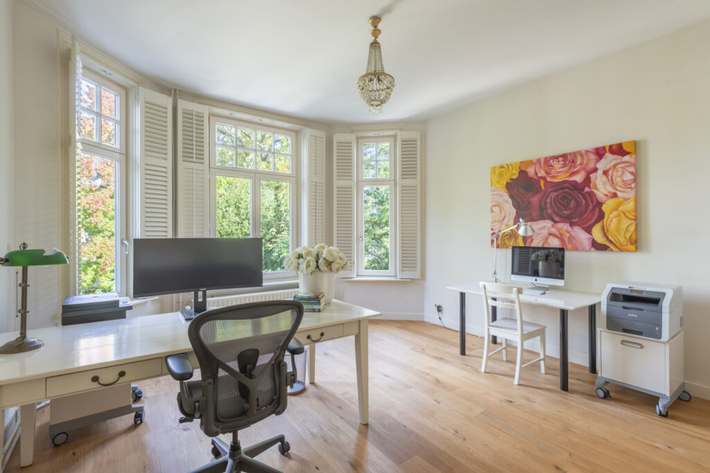 Bright home office with dual workstations.