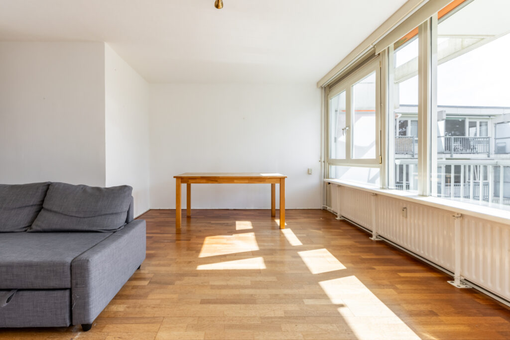 Bright room with sofa and table.