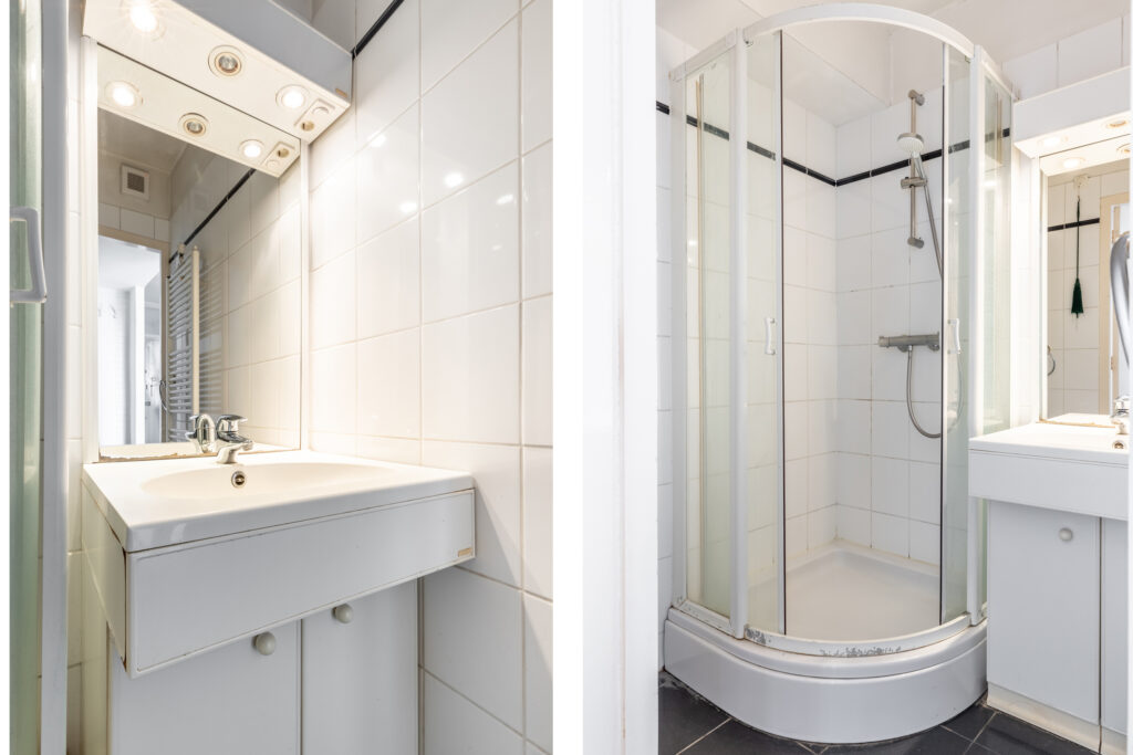 Small white bathroom with shower and sink.