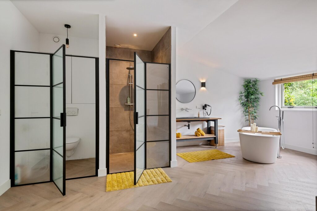 Modern bathroom with shower and freestanding bathtub.