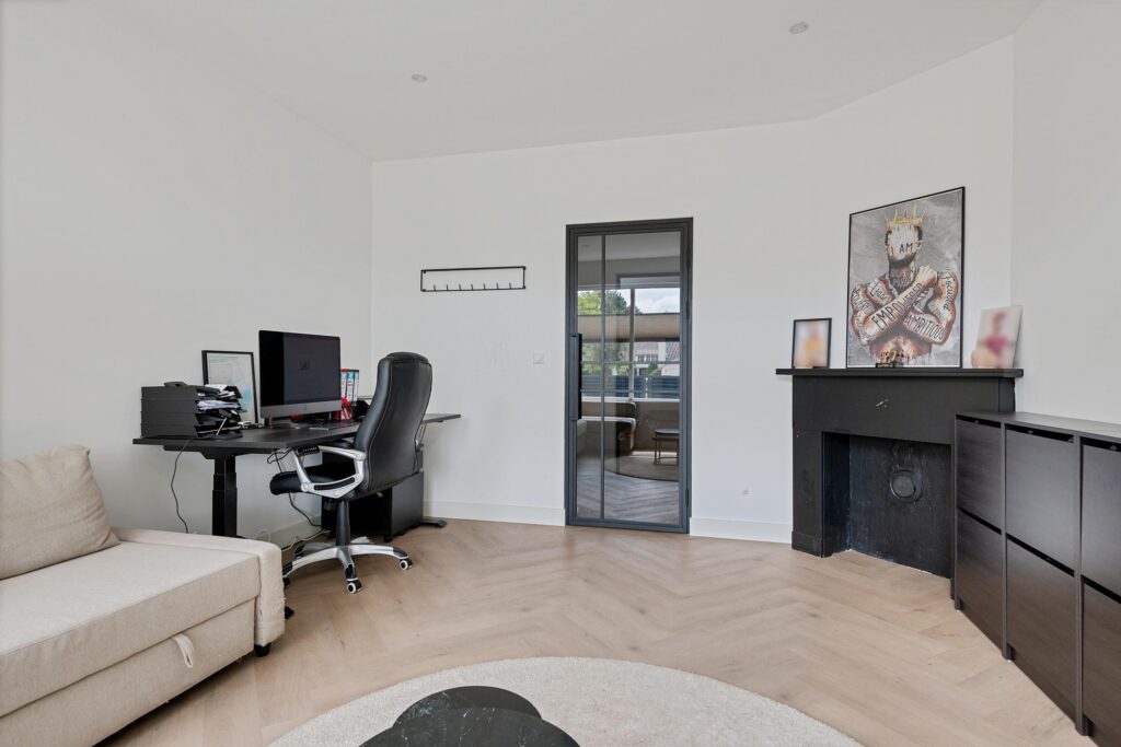 Modern home office with desk and chair.