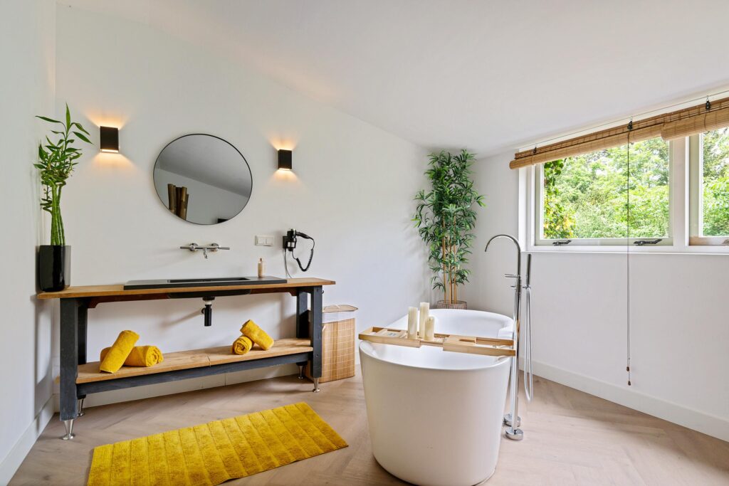 Modern bathroom with bathtub and wooden accents.