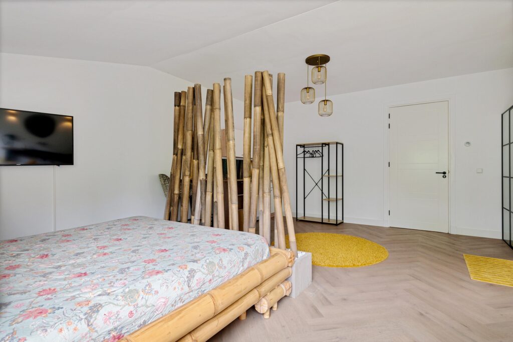 Minimalist bedroom with bamboo decor and modern touches.