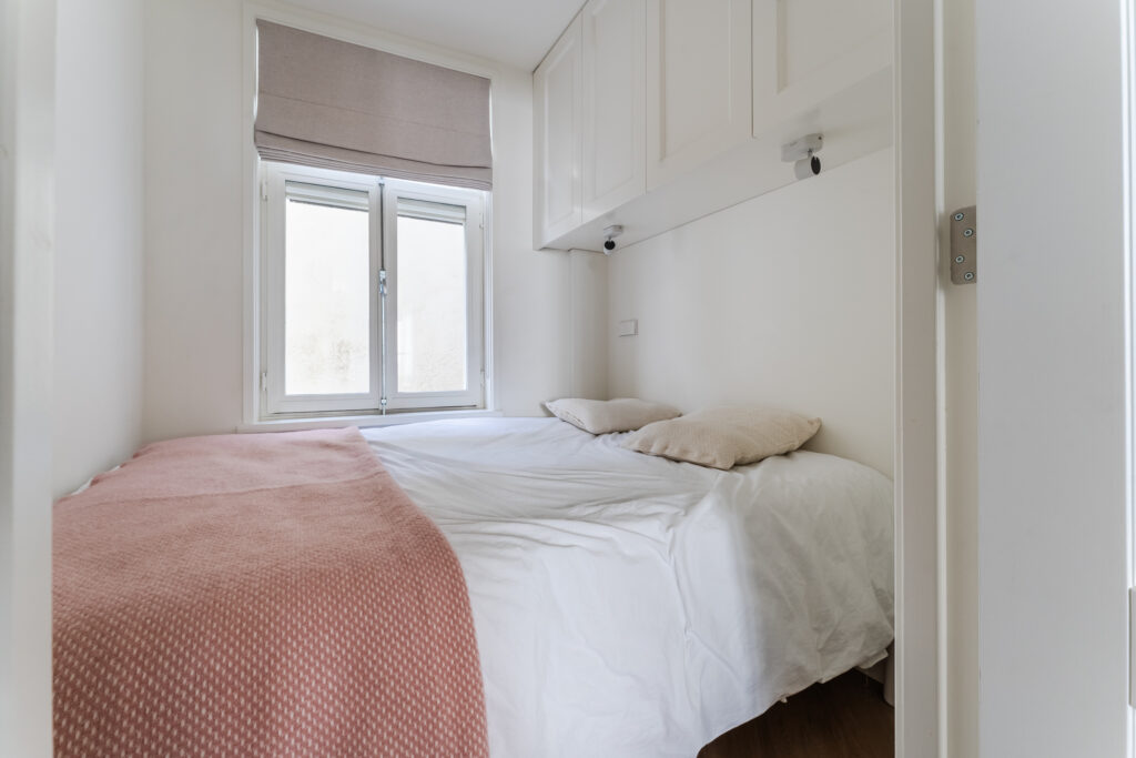 Cozy small bedroom with natural light.