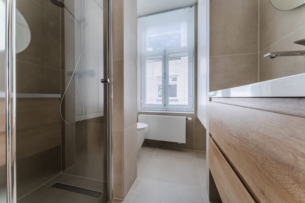 Modern bathroom with shower and window blinds
