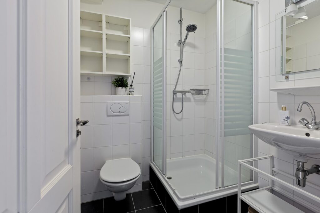 Modern bathroom with shower, toilet, and sink