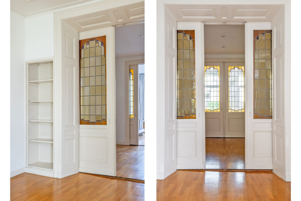 White wooden sliding doors with stained glass panels