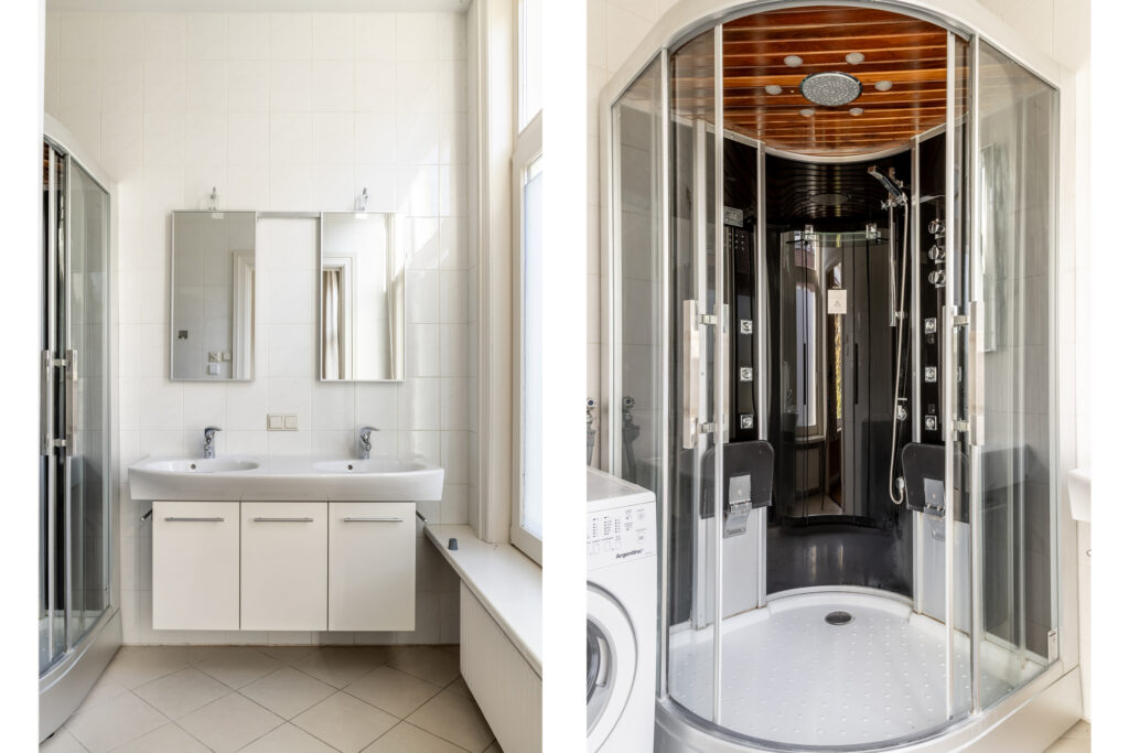 Modern bathroom with double sink and enclosed shower