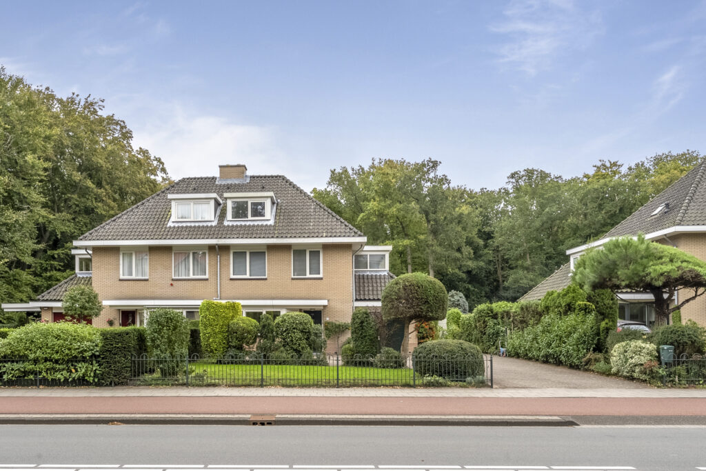 Residential house with garden and trees