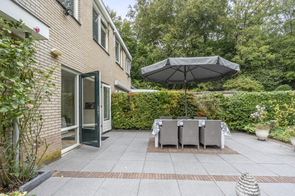 Outdoor patio with table and umbrella