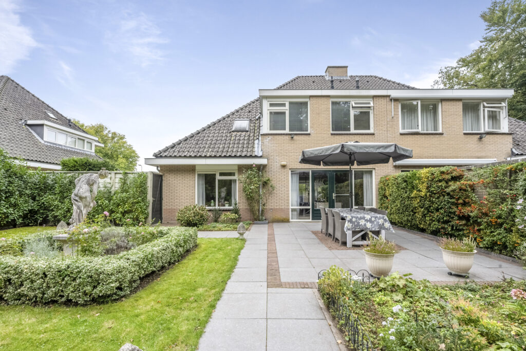 Backyard with garden, patio, and umbrella table