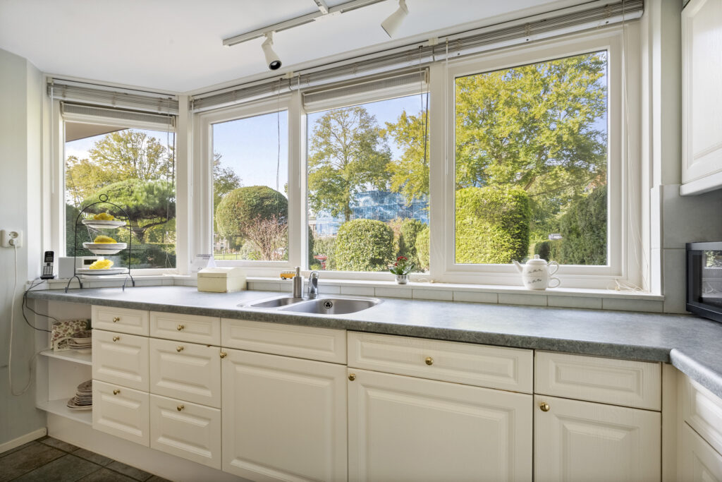 Bright kitchen with garden view from windows