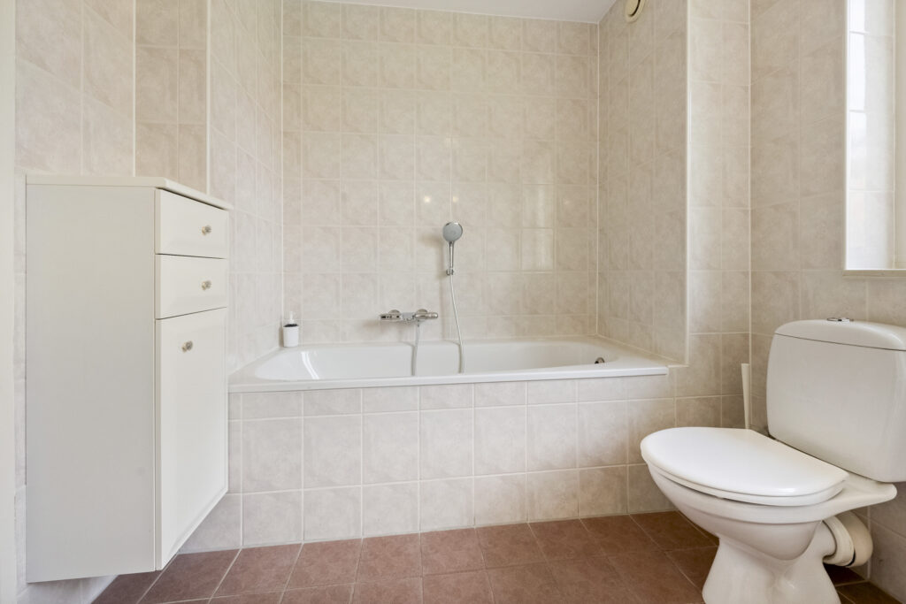 Modern bathroom with bathtub and toilet