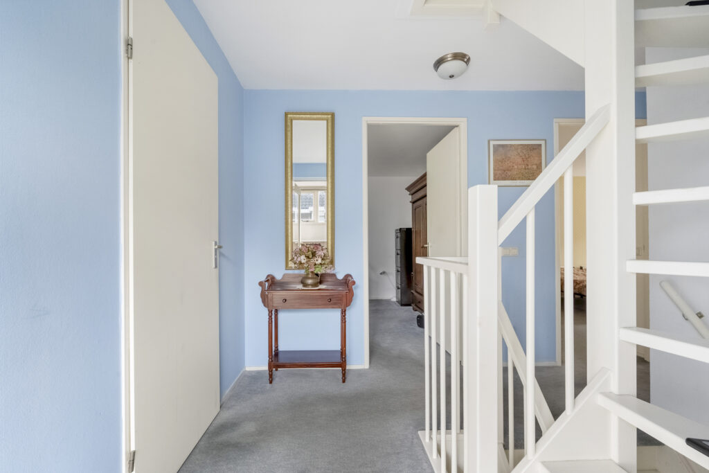 Bright hallway with decorative table and mirror