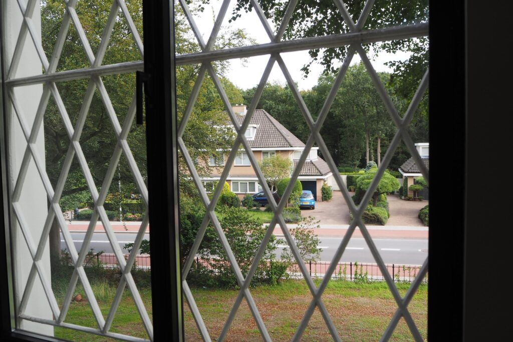 View of suburban house through window