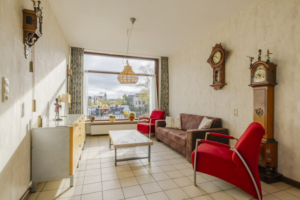Cozy living room with vintage decor and clocks.