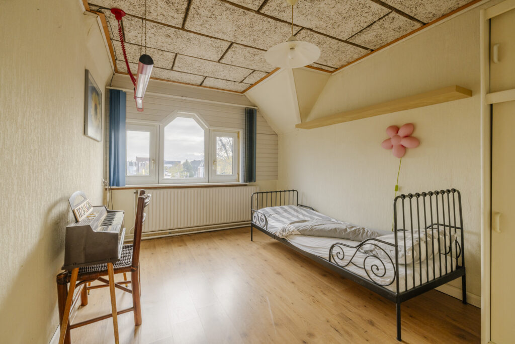 Cozy bedroom with bed and keyboard