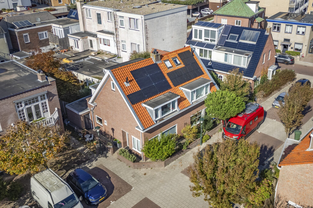 Aerial view of houses with solar panels.