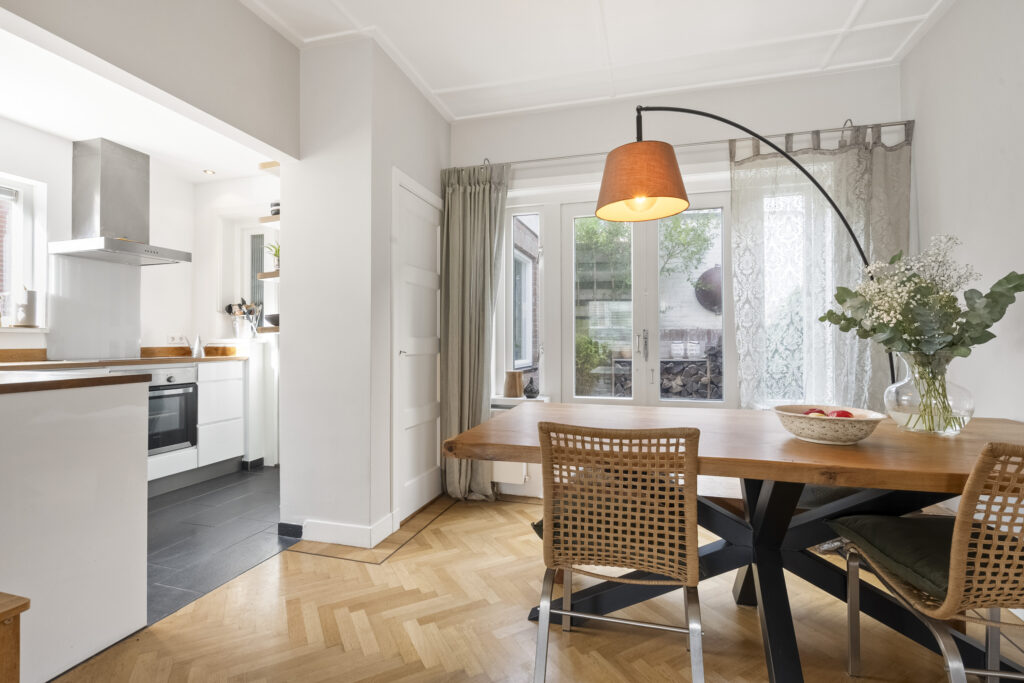 Modern kitchen dining area with wooden table