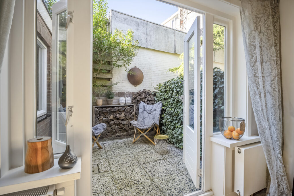 Cozy patio with open door and chairs