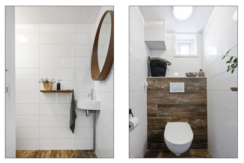 Minimalist bathroom with white tiles and wooden accents