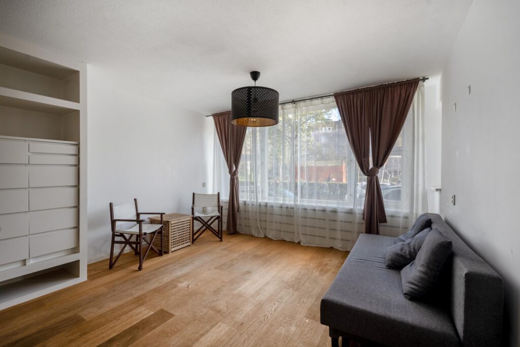 Minimalist living room with modern furniture and decor.