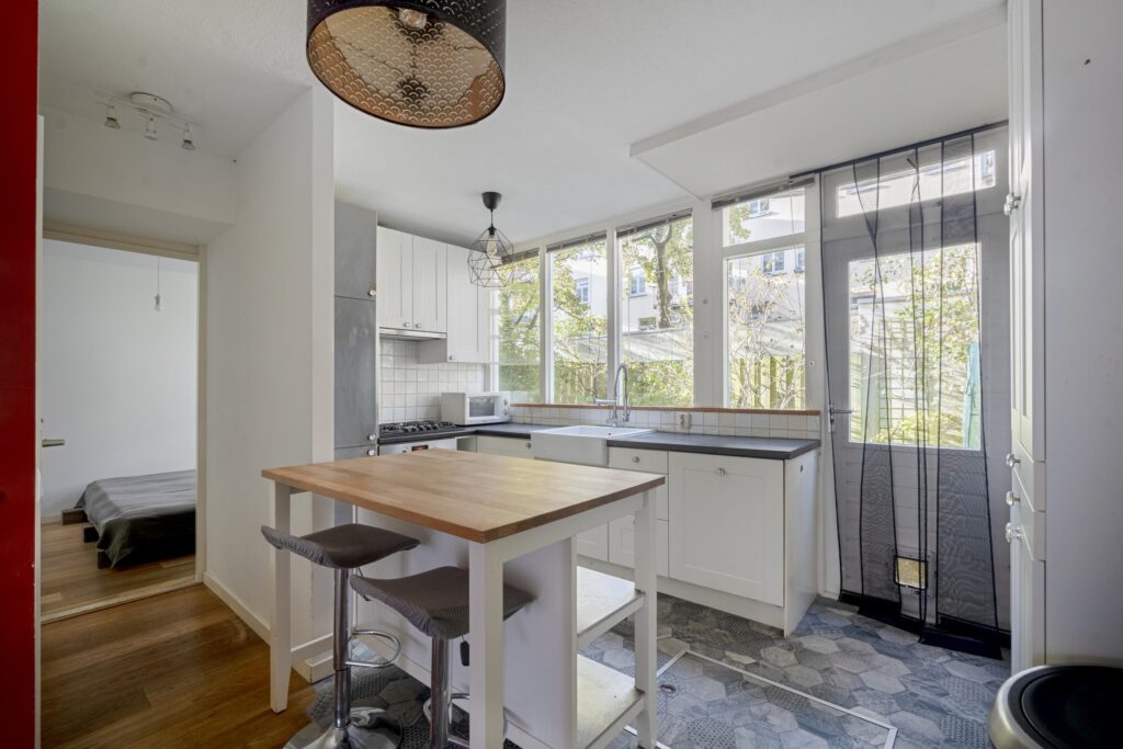 Bright kitchen with modern appliances and island.