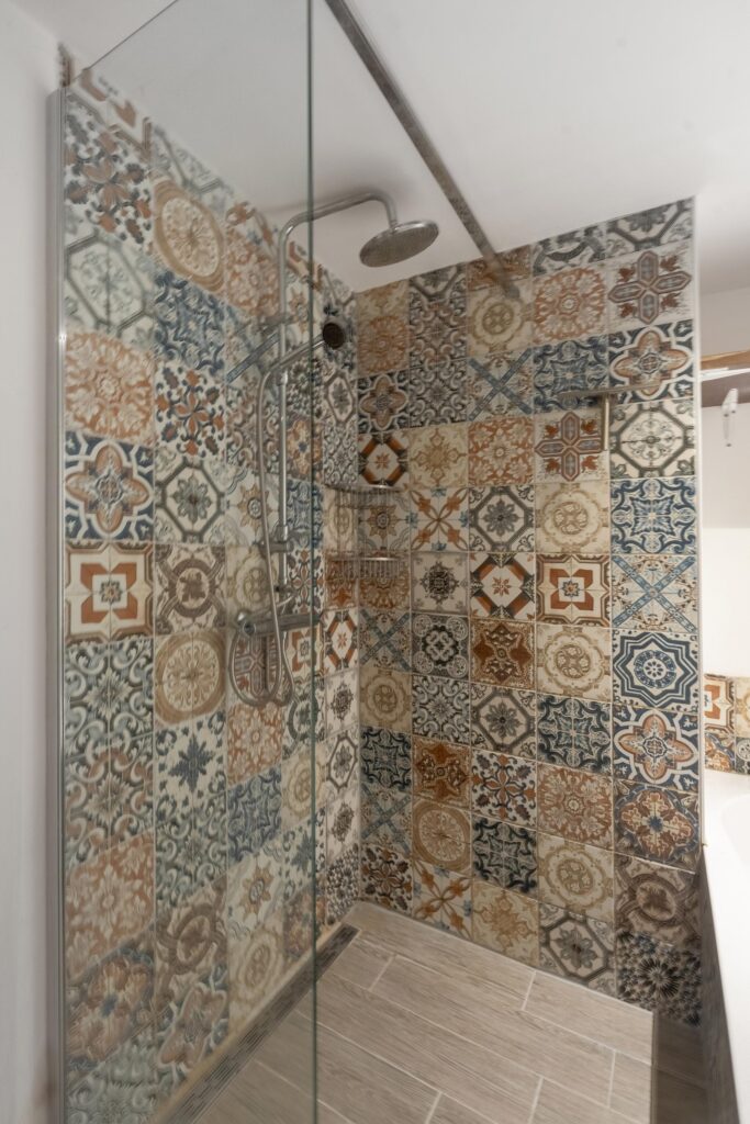 Shower with colorful patterned tiles